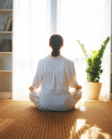 Woman meditating at home | Home Insurance Quotes | An Post Insurance