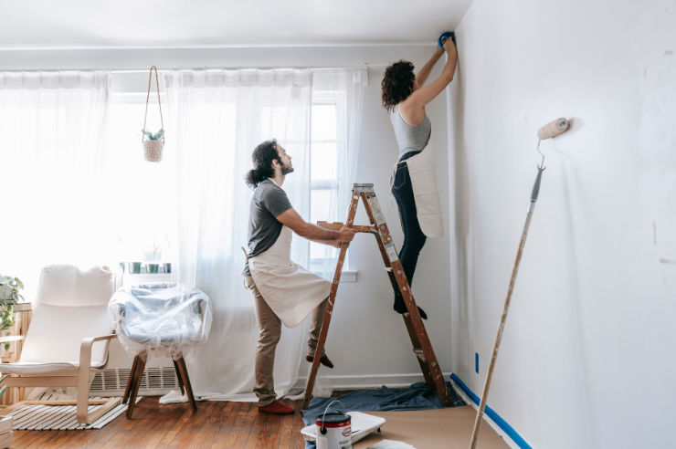 Couple painting living room | To-Dos for New Homeowners | An Post Insurance