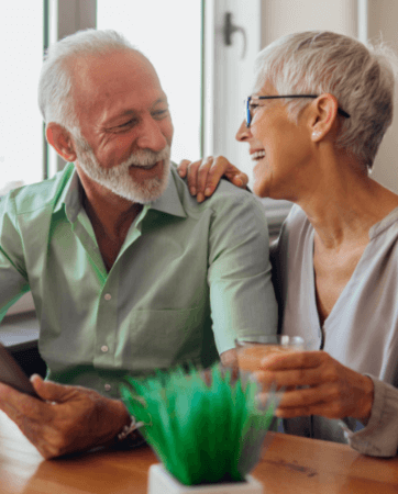 Happy retired couple after planning their will | Funeral Insurance Quotes